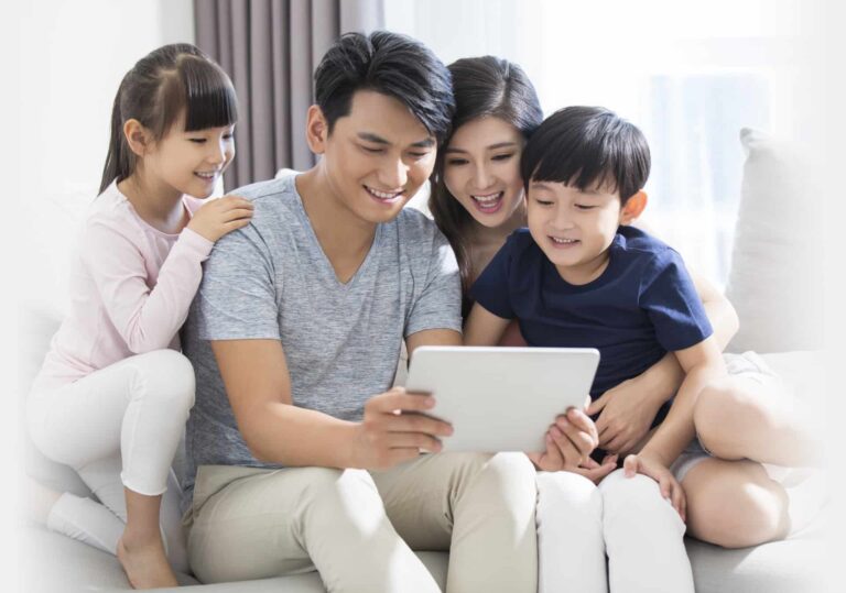 happy-young-family-using-digital-tablet-at-home