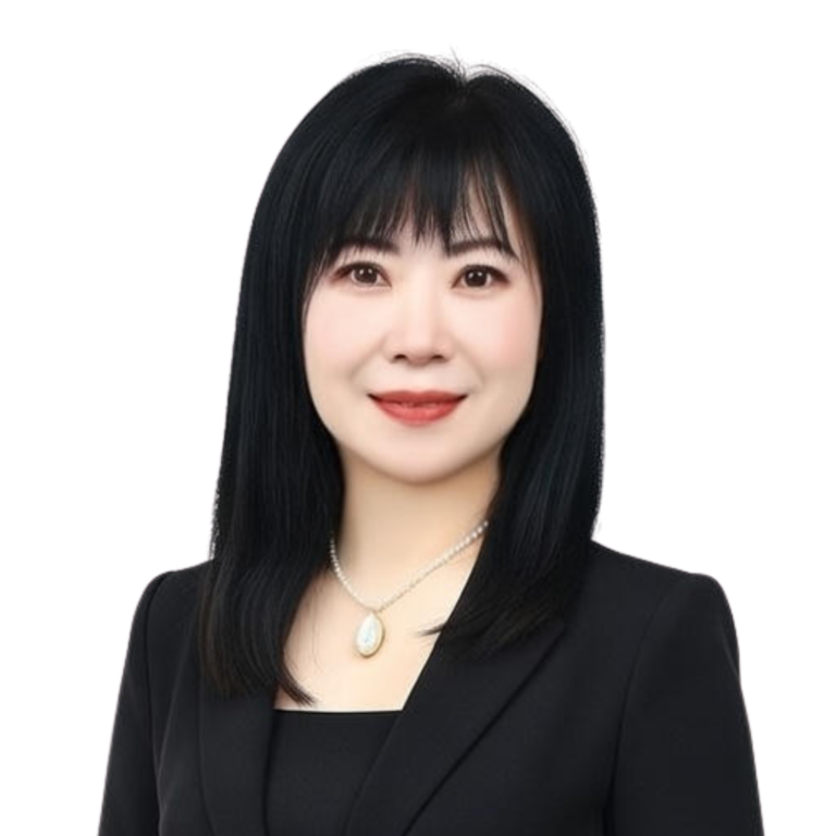 Woman with straight black hair, a black blazer, and a necklace poses in front of a plain white background, representing PreceptsGroup Staff—experienced estate planning practitioners.